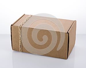 Cardboard box tied with rope. The packaging of the parcel