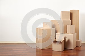 Cardboard boxes in apartment, moving day photo