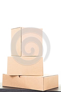 Cardboard Boxes brown closed in table white background