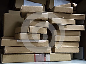 Cardboard boxes with computer components on the shelf of the ser