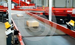 Cardboard boxes on conveyor belt.parcels transportation system concept