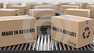 Cardboard boxes with Made in Kiribati text on roller conveyor