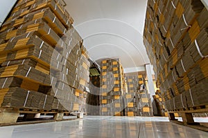 Cardboard boxes on a pallet, Rack stack arrangement of cardboard boxes in a store warehouse