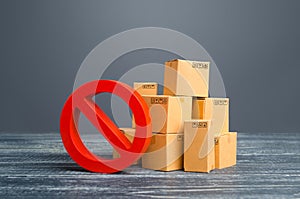 Cardboard boxes and red prohibition symbol NO. Restriction on import, ban on export of dual-use goods to countries under sanctions