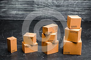 Cardboard boxes are stacked incrementally. The concept of packing goods, sending orders to customers. Sales growth