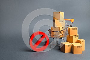 Cardboard boxes, supermarket trolley and red symbol NO. Embargo, trade wars. Restriction on the importation of goods, proprietary photo