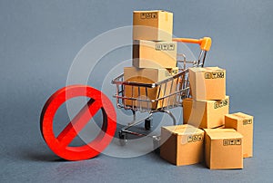 Cardboard boxes, supermarket trolley and red symbol NO. Embargo, trade wars. Restriction on the importation of goods, proprietary photo
