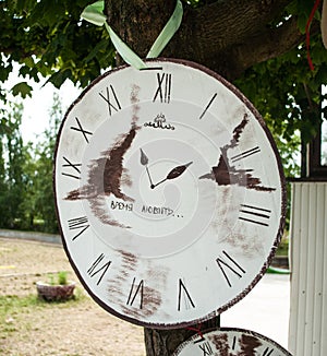 Cardboard clock put on the tree