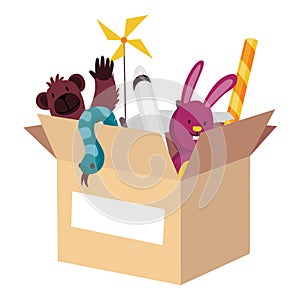 Cardboard donation box full of toys and devices. Charity and donate for poor people, help homeless and support needy