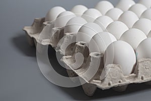 Cardboard egg box with chicken white eggs