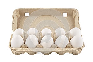 Cardboard egg box with ten eggs. Isolated