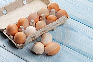 Cardboard egg box on wooden table