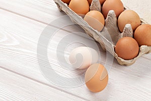 Cardboard egg box on wooden table