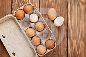 Cardboard egg box on wooden table