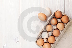 Cardboard egg box on wooden table