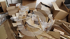 Cardboard and film waste. Used shipping boxes. Sheets or stiff multi layered papers that have been used, discarded or