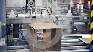 Cardboard package box packing machine. Clip. Box forming production line