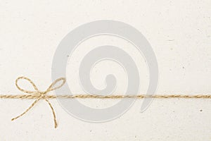 Cardboard Paper Background with Bow Rope, Carton Vintage Twine