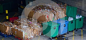 Cardboard and rubbish in waste compound for disposal at dump site