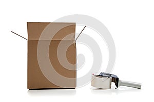 Cardboard shipping box with a tape gun