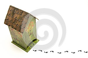 Cardboard small house. Children`s toy. Traces of man. On white background