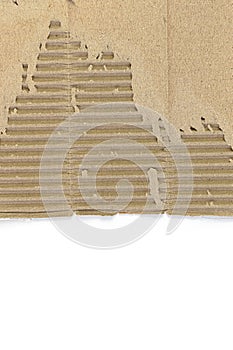 Cardboard with torn edges Kraft paper texture striped pattern for wrapping. texture background. ripped piece of cardboard isolated