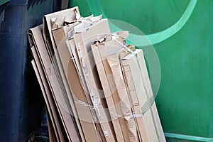 Cardboard and waste paper is collected and packaged for recycling. Cardboard is bundled into bales. Urban Recycling