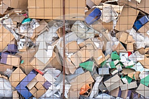 Cardboard waste pile stacked on a landfill