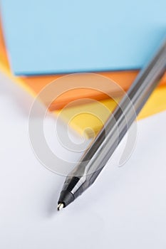 Cardboard on a white table with a black pen