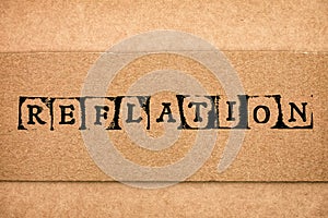 Cardboard with word Reflation