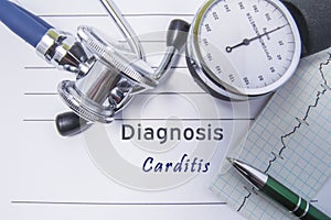 Cardiac diagnosis Carditis. Medical form report with written diagnosis of Carditis lying on the table in doctor cabinet, surrounde photo