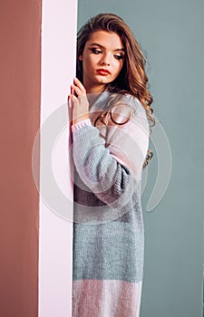 A cardigan featuring her longline silhouette. Casual knitted sweater design trend for fall. Fashion girl wear cute