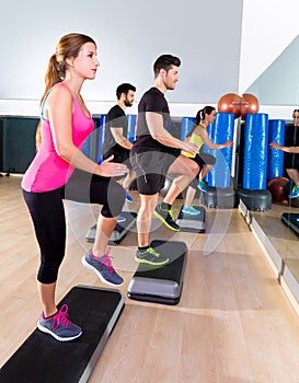 Cardio step dance group at fitness gym training