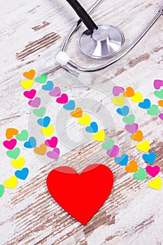 Cardiogram line of paper hearts and stethoscope, medicine and healthcare concept