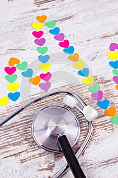 Cardiogram line of paper hearts and stethoscope, medicine and healthcare concept
