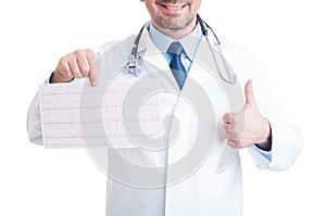 Cardiologist holding healthy ekg and making encouraging like gesture