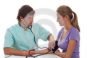 Cardiologist testing blood pressure