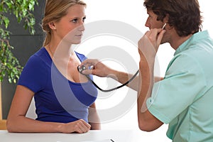 Cardiologist testing a patient