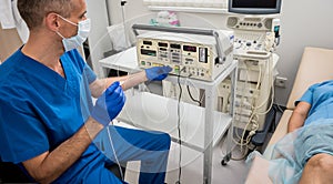 Cardiologist use tubes for radiofrequency catheter ablation. photo