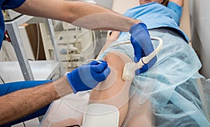 Cardiologist use tubes and ultrasound for radiofrequency catheter ablation. photo
