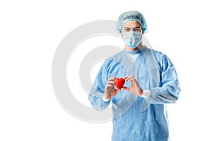 Cardiologist wearing blue uniform and holding toy heart