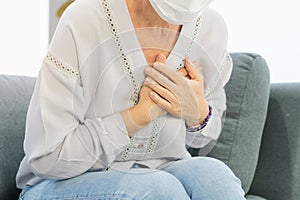 Cardiology, angina caucasian mature woman hand hold chest with pain and suffer, having heart attack, hurt sudden coronary symptom