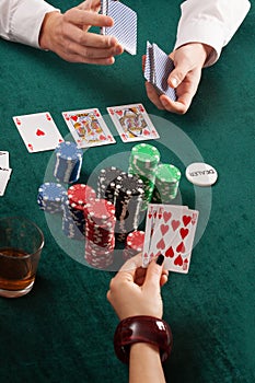 Cards, colorful poker chips and alcohol