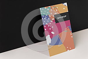 Colorful paperboard mockup against the black wall photo