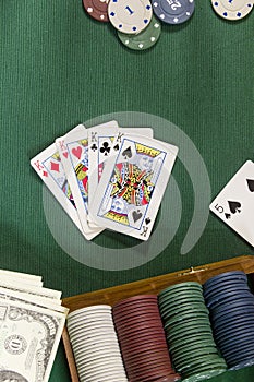 Cards with poker hand with chips and money