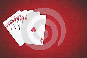 Cards for Poker on a red background, poker hands royal flush.