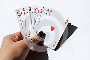 The cards in woman`s hand. Woman playing a game.