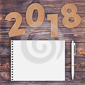 Cardstock Numbers 2018 Happy New Year Sign near White Spiral Pap