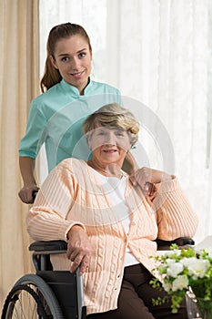 Care assistant pushing the wheelchair