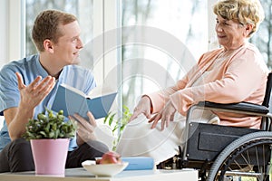 Care assistant reading book